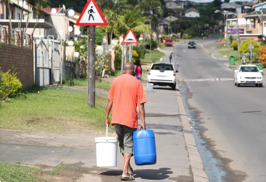 A South African man carries water, symbolising the daily struggle faced by communities grappling with severe water shortages. His journey reflects not just the physical burden, but the growing frustration and demand for political accountability in the fight for basic human rights.  Image: Doctor Ngcobo/African News Agency (ANA)